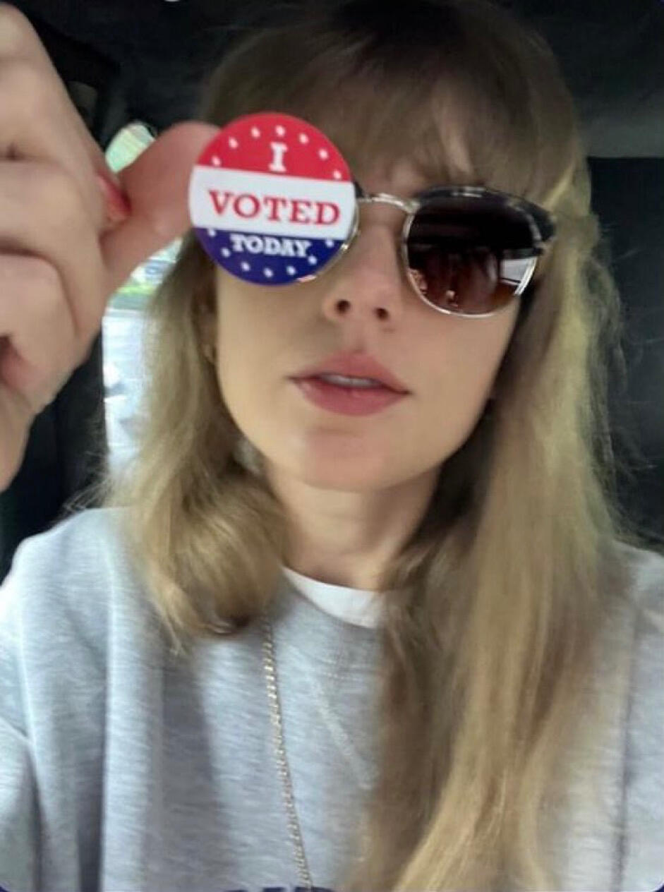 Taylor Swift holding an "I Voted Today" sticker